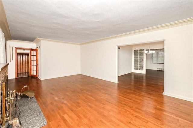 12810 Big Bend Rd, Kirkwood, MO 63122 - unfurnished living room featuring crown molding, wood finished floors, a chandelier, a fireplace with raised hearth, and baseboards