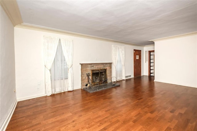 12810 Big Bend Rd, Kirkwood, MO 63122 - unfurnished living room featuring crown molding, wood finished floors, a stone fireplace, and baseboards