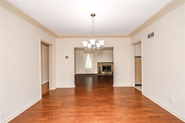 12810 Big Bend Rd, Kirkwood, MO 63122 - unfurnished living room featuring a chandelier, wood finished floors, crown molding, and baseboards