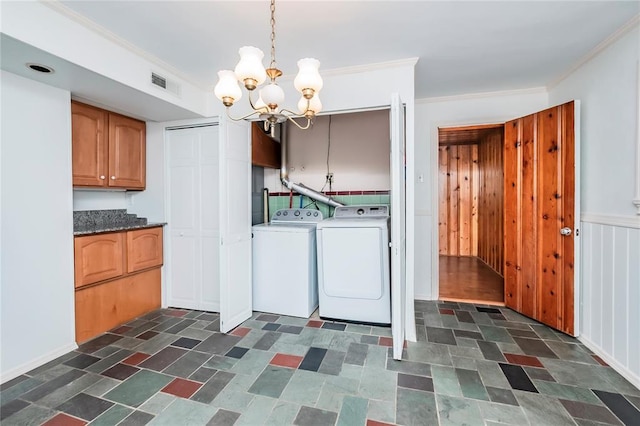 12810 Big Bend Rd, Kirkwood, MO 63122 - laundry area featuring washer and clothes dryer, a chandelier, and crown molding