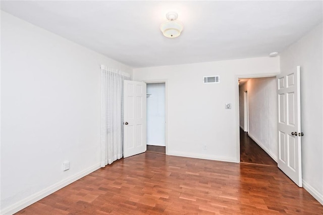 12810 Big Bend Rd, Kirkwood, MO 63122 - unfurnished bedroom with wood finished floors and baseboards