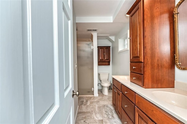 12810 Big Bend Rd, Kirkwood, MO 63122 - full bathroom with double vanity, toilet, a shower, and baseboards