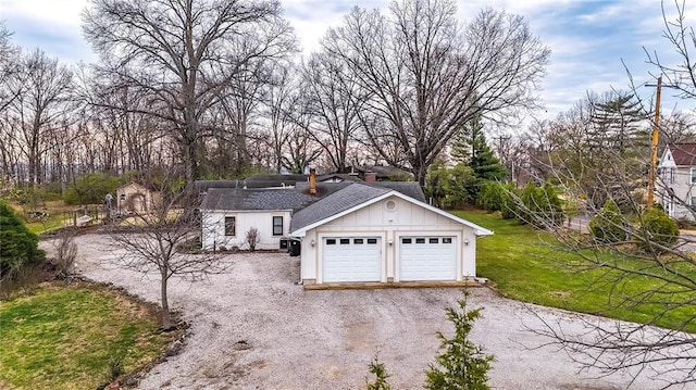 12810 Big Bend Rd, Kirkwood, MO 63122 - view of front facade with a garage, a chimney, roof with shingles, a front yard, and driveway