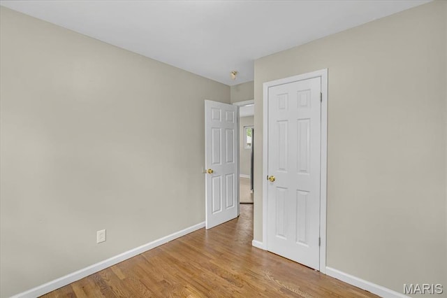 3368 S Suncrest Ave, Saint Louis, MO 63114 - spare room with baseboards and light wood-type flooring