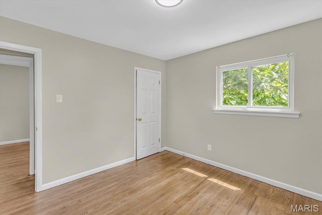 3368 S Suncrest Ave, Saint Louis, MO 63114 - unfurnished bedroom with baseboards and light wood-style floors