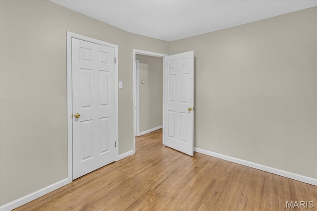 3368 S Suncrest Ave, Saint Louis, MO 63114 - unfurnished bedroom with light wood-style flooring