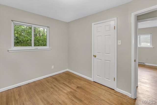 3368 S Suncrest Ave, Saint Louis, MO 63114 - spare room featuring light wood-type flooring and healthy amount of natural light