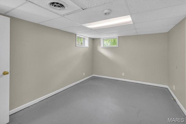 3368 S Suncrest Ave, Saint Louis, MO 63114 - below grade area featuring baseboards and a drop ceiling