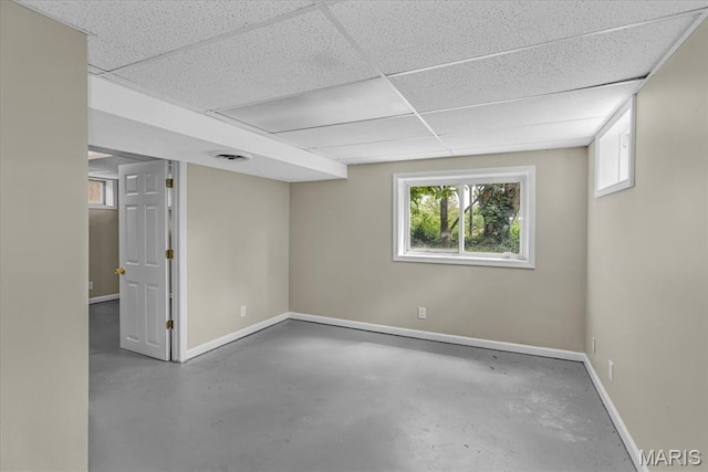 3368 S Suncrest Ave, Saint Louis, MO 63114 - basement featuring baseboards and a paneled ceiling