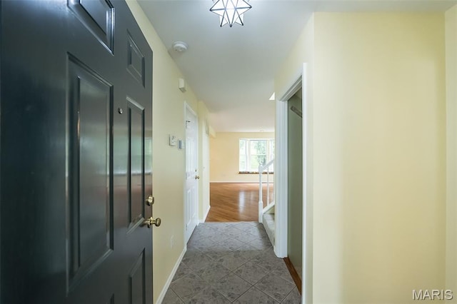 1105 Big Bend Crossing Dr, Manchester, MO 63088 - hallway with baseboards and dark tile patterned flooring