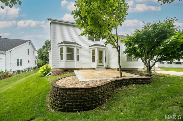 1105 Big Bend Crossing Dr, Manchester, MO 63088 - back of house featuring entry steps, a patio area, and a lawn