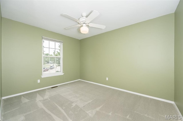 1105 Big Bend Crossing Dr, Manchester, MO 63088 - spare room featuring baseboards, light colored carpet, and ceiling fan
