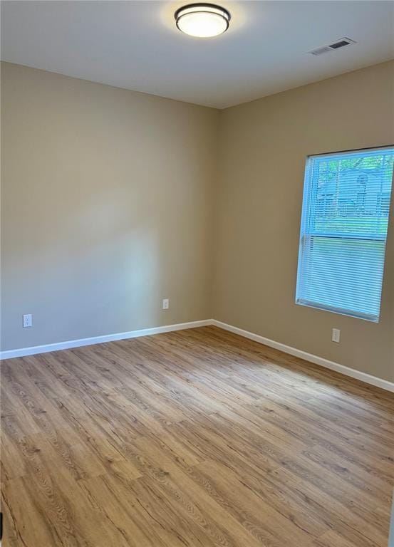 812 Main St, New London, MO 63459 - spare room featuring wood finished floors and baseboards