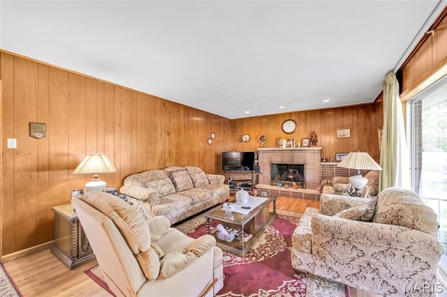 8967 New Sappington Rd, Crestwood, MO 63126 - living area with wood finished floors, wooden walls, and a fireplace