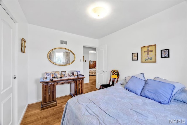 8967 New Sappington Rd, Crestwood, MO 63126 - bedroom featuring wood finished floors and baseboards