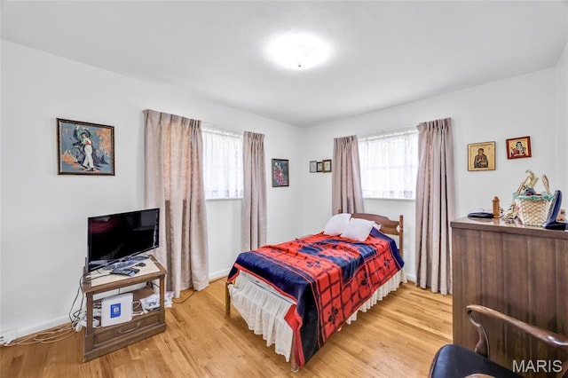 8967 New Sappington Rd, Crestwood, MO 63126 - bedroom featuring multiple windows, wood finished floors, and baseboards