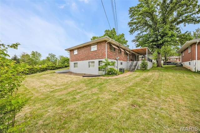 8967 New Sappington Rd, Crestwood, MO 63126 - back of property featuring stairway, a yard, brick siding, and cooling unit