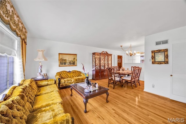 8967 New Sappington Rd, Crestwood, MO 63126 - living area with a chandelier and light wood finished floors