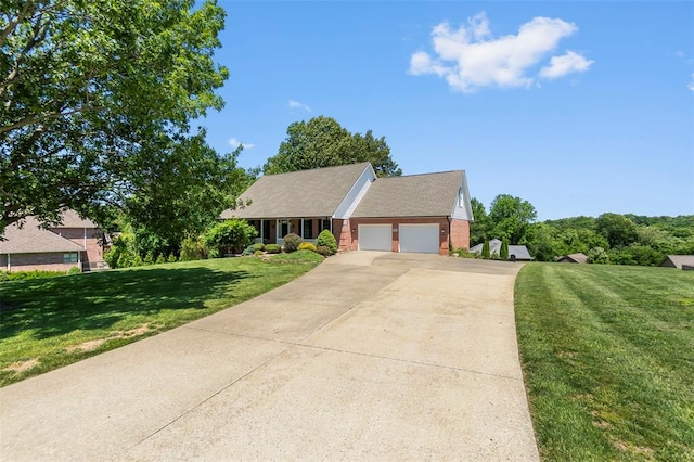 1014 Trailridge Dr, Jackson, MO 63755 - view of front of property with an attached garage, concrete driveway, a front yard, and brick siding