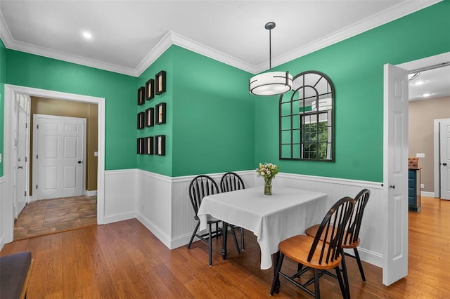 1014 Trailridge Dr, Jackson, MO 63755 - dining area featuring wainscoting, wood finished floors, and crown molding