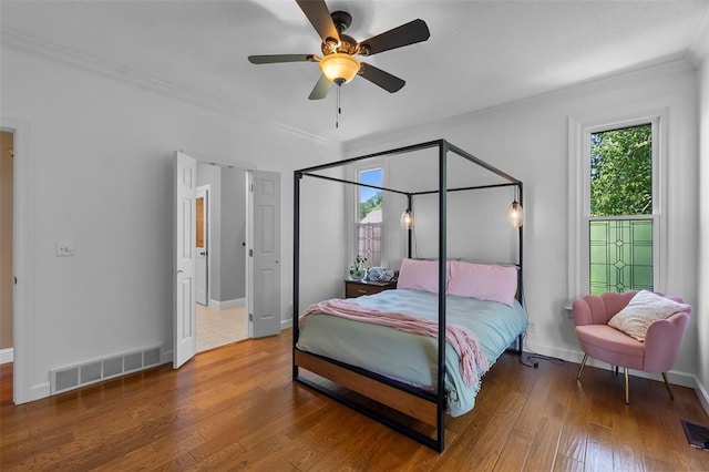 1014 Trailridge Dr, Jackson, MO 63755 - bedroom with crown molding, wood finished floors, baseboards, and ceiling fan