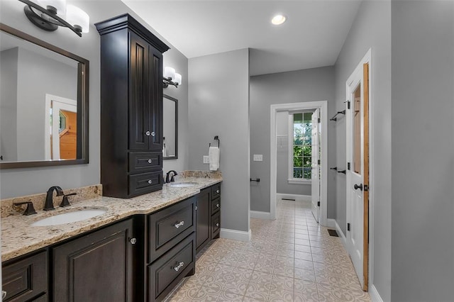 1014 Trailridge Dr, Jackson, MO 63755 - full bath featuring double vanity, baseboards, and tile patterned flooring