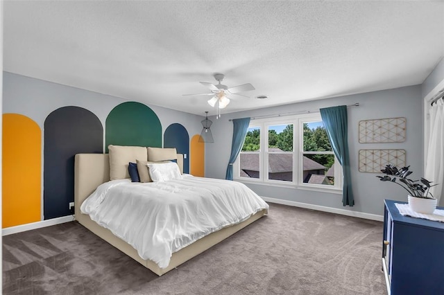 1014 Trailridge Dr, Jackson, MO 63755 - carpeted bedroom with baseboards, ceiling fan, a textured ceiling, and arched walkways