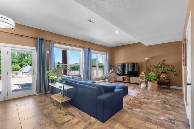 1014 Trailridge Dr, Jackson, MO 63755 - living room featuring a textured ceiling and baseboards