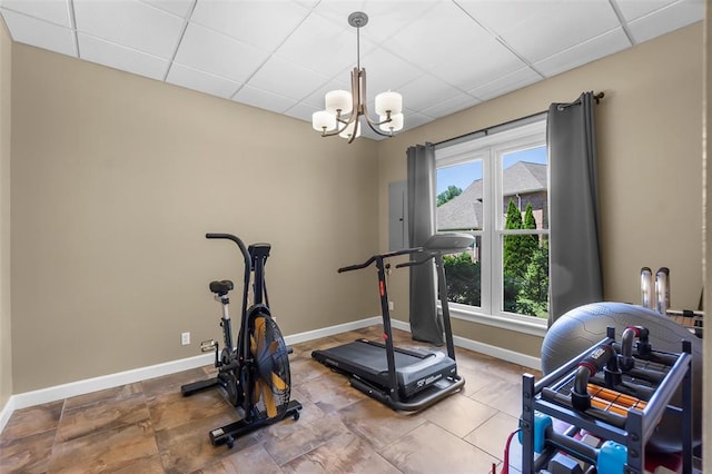 1014 Trailridge Dr, Jackson, MO 63755 - workout room with a paneled ceiling, baseboards, and a chandelier