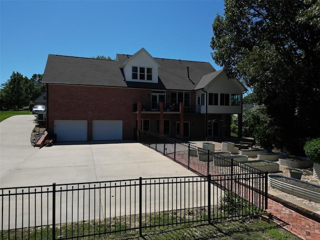 1014 Trailridge Dr, Jackson, MO 63755 - view of front of house with concrete driveway, brick siding, and an attached garage