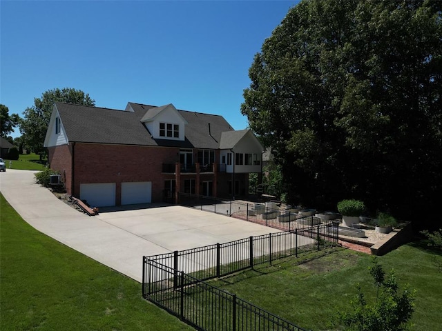 1014 Trailridge Dr, Jackson, MO 63755 - view of front of house with brick siding, a garage, driveway, a patio, and central air condition unit