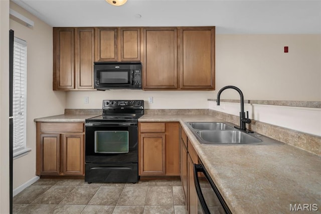 160 Brandy Mill Cir Unit 7C, High Ridge, MO 63049 - kitchen with black appliances, brown cabinetry, and light countertops