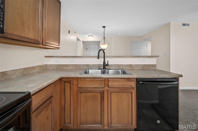 160 Brandy Mill Cir Unit 7C, High Ridge, MO 63049 - kitchen with black appliances, brown cabinetry, a peninsula, carpet floors, and pendant lighting