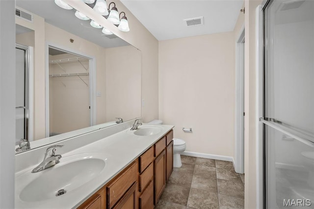 160 Brandy Mill Cir Unit 7C, High Ridge, MO 63049 - bathroom featuring a stall shower, double vanity, and a spacious closet