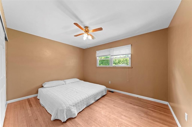 2535 S Park Ln, Florissant, MO 63031 - bedroom with baseboards, light wood-type flooring, and a ceiling fan