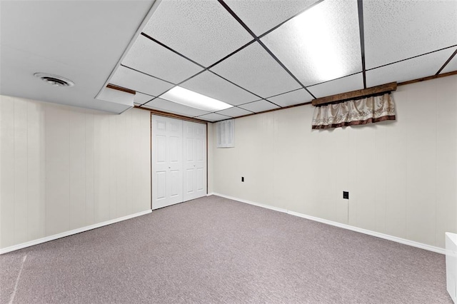 2535 S Park Ln, Florissant, MO 63031 - finished below grade area featuring a drop ceiling, carpet, and baseboards