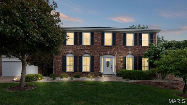 2854 Championship Blvd, Saint Louis, MO 63129 - view of front facade featuring brick siding and a front yard