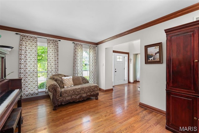 2854 Championship Blvd, Saint Louis, MO 63129 - living room featuring light wood-style floors, baseboards, and ornamental molding