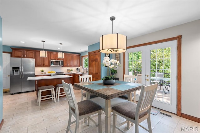 2854 Championship Blvd, Saint Louis, MO 63129 - dining room featuring french doors, recessed lighting, light tile patterned flooring, and baseboards