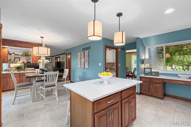 2854 Championship Blvd, Saint Louis, MO 63129 - kitchen with light tile patterned floors, light countertops, pendant lighting, and recessed lighting
