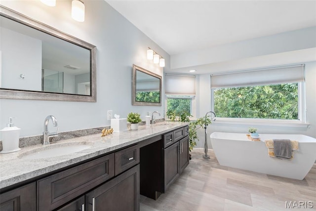 2854 Championship Blvd, Saint Louis, MO 63129 - full bath featuring double vanity and a freestanding tub