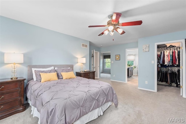 2854 Championship Blvd, Saint Louis, MO 63129 - bedroom featuring baseboards, carpet floors, a walk in closet, a closet, and ceiling fan