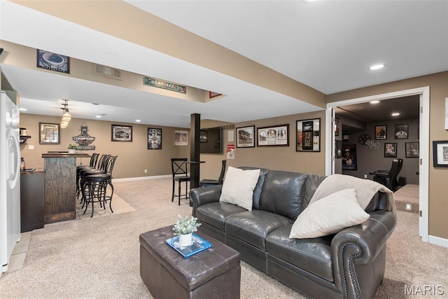 2854 Championship Blvd, Saint Louis, MO 63129 - living area featuring light colored carpet, recessed lighting, baseboards, and bar area