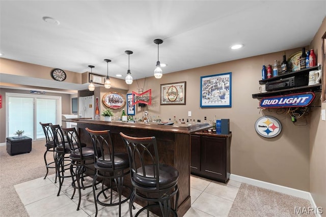 2854 Championship Blvd, Saint Louis, MO 63129 - indoor wet bar featuring baseboards, recessed lighting, hanging light fixtures, and light tile patterned flooring