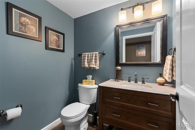 2854 Championship Blvd, Saint Louis, MO 63129 - half bathroom with vanity, toilet, and baseboards