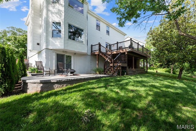 2854 Championship Blvd, Saint Louis, MO 63129 - back of house with stairway, a deck, a patio, a lawn, and an outdoor fire pit