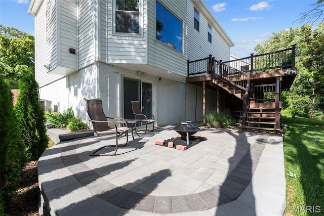 2854 Championship Blvd, Saint Louis, MO 63129 - view of patio featuring stairway, a wooden deck, and a fire pit