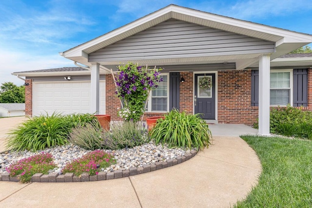 1354 Nutmeg Dr, Saint Charles, MO 63303 - view of front facade with brick siding, a garage, a porch, and concrete driveway