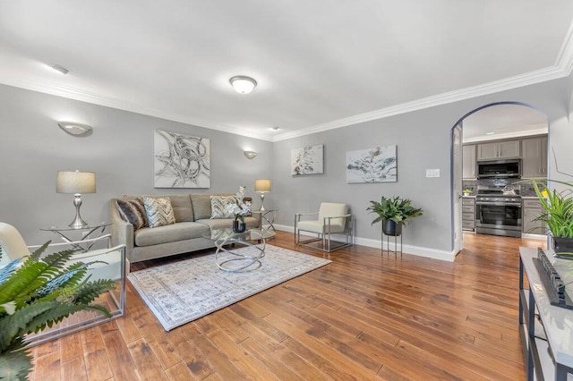 1354 Nutmeg Dr, Saint Charles, MO 63303 - living area featuring ornamental molding, wood finished floors, baseboards, and arched walkways