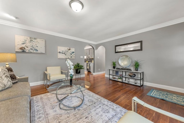 1354 Nutmeg Dr, Saint Charles, MO 63303 - living area featuring arched walkways, ornamental molding, baseboards, and wood finished floors